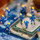 Tiny technicians fixing a small error
